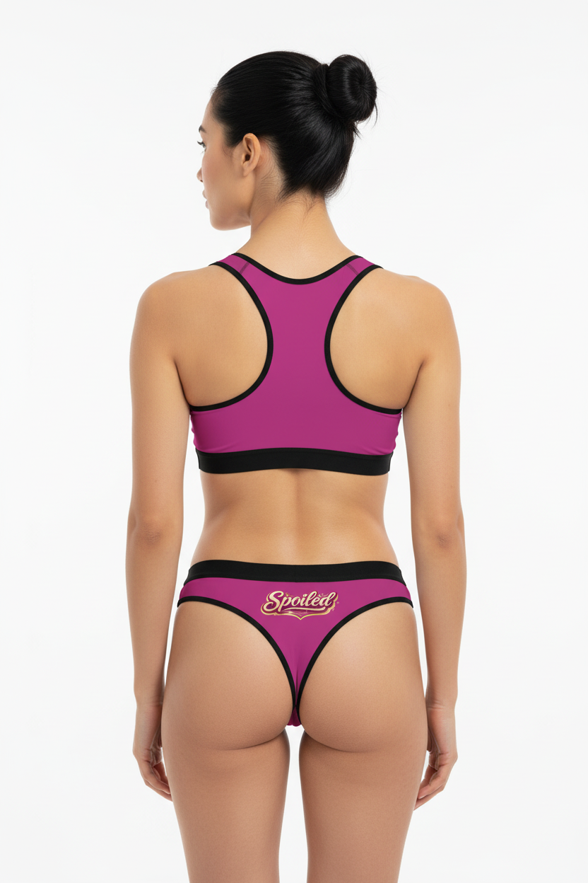 Back view of woman in Spoiled pink sports bra and thong